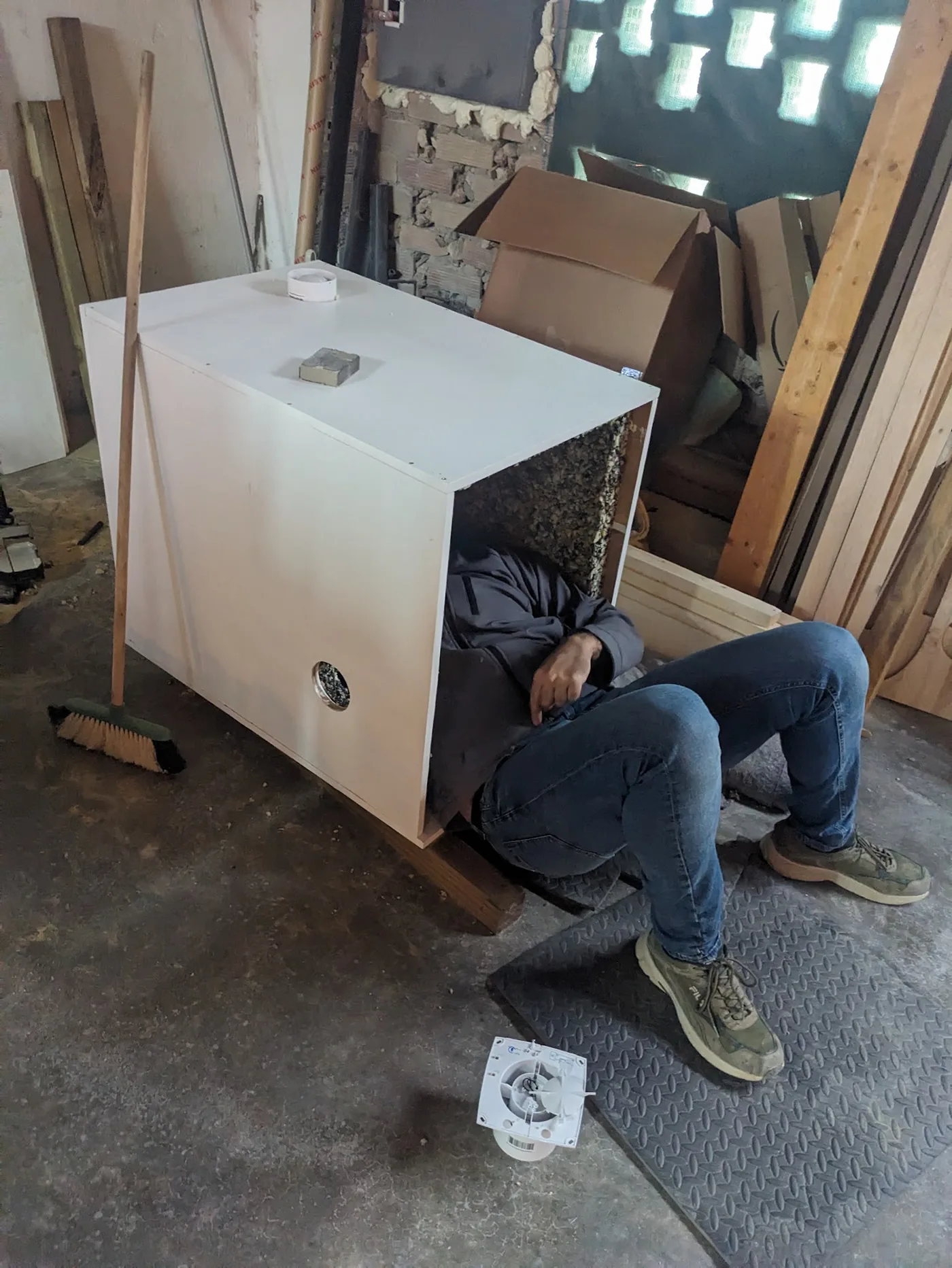 Sound-isolation enclosure being assembled from reclaimed timber panels