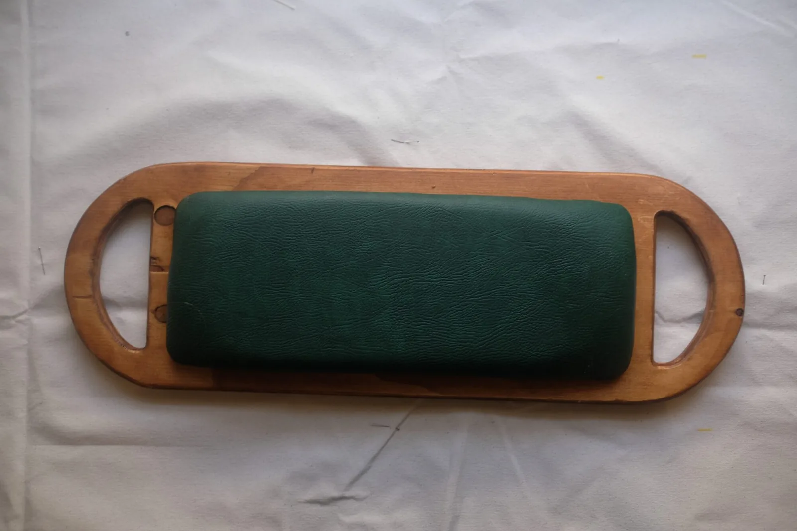 The finished seat from above, wood and green leather