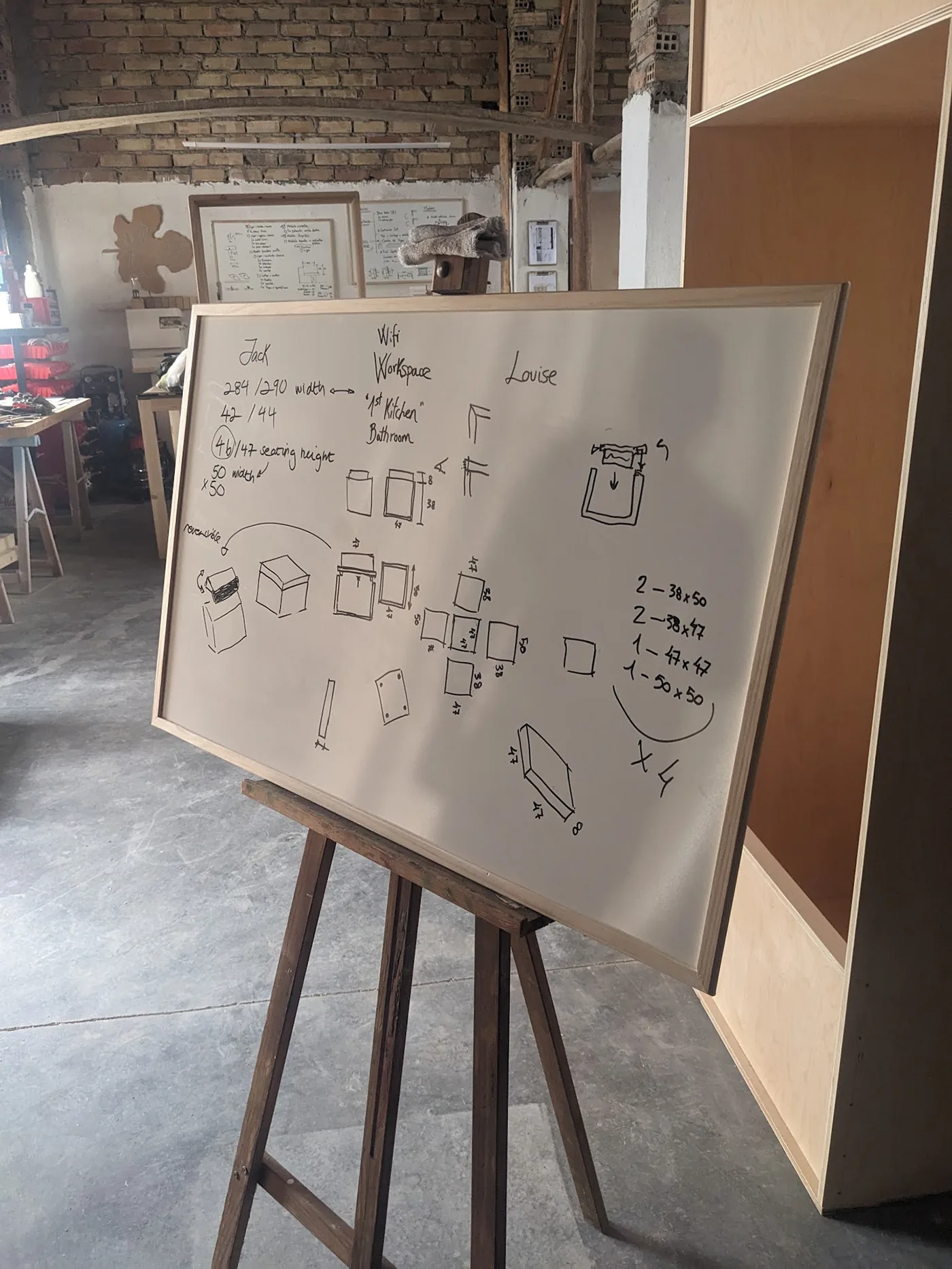 Early table sketches on a workshop drawing board