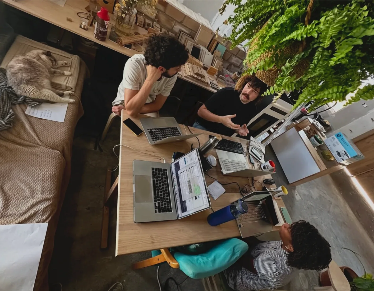 The workshop team gathered around the table during a design session