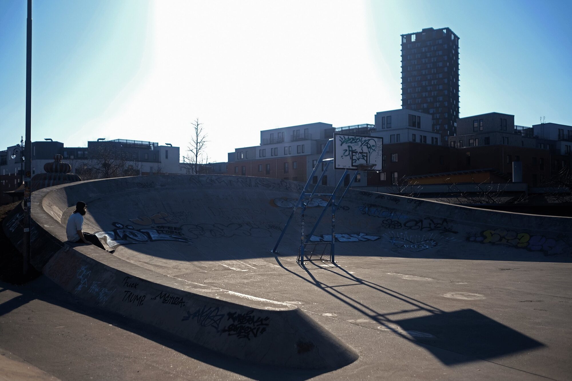 A basketball court edge used as a place to sit